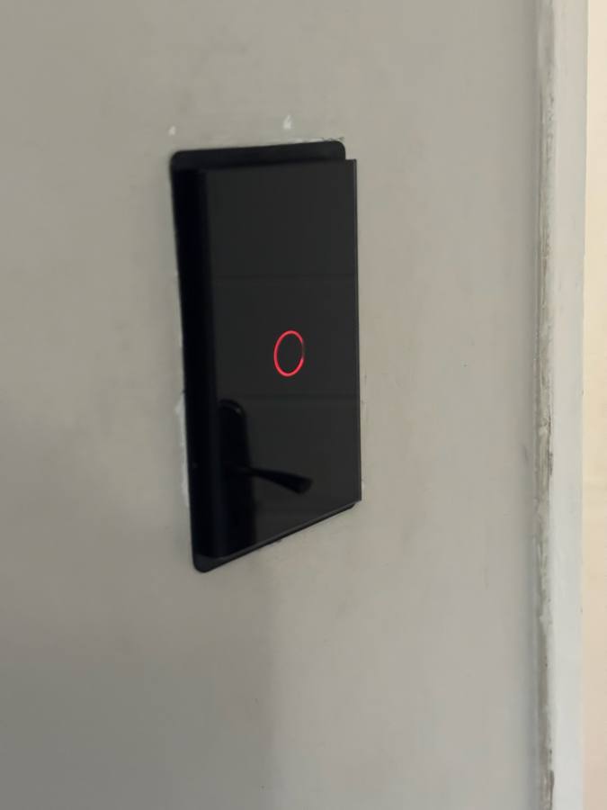 Smart touch switch fitted in place of a standard wall switch